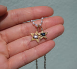 StarLight charm with dark blue star sapphire and diamond