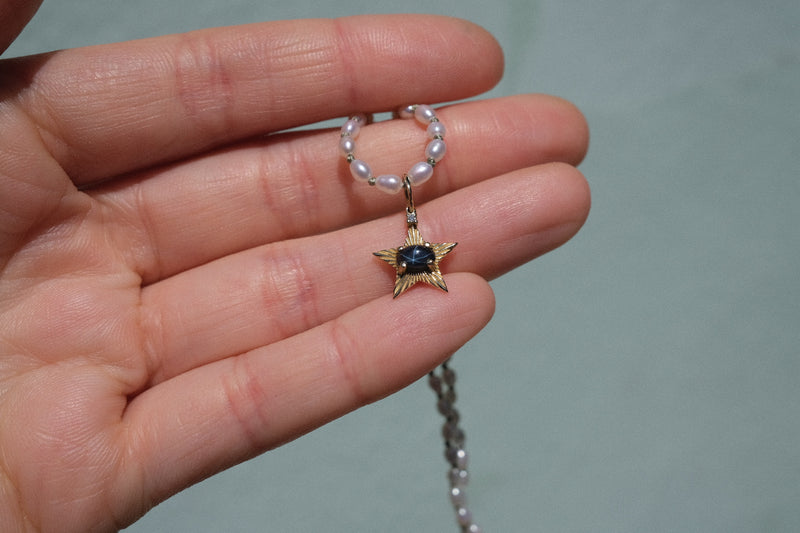 StarLight charm with dark blue star sapphire and diamond